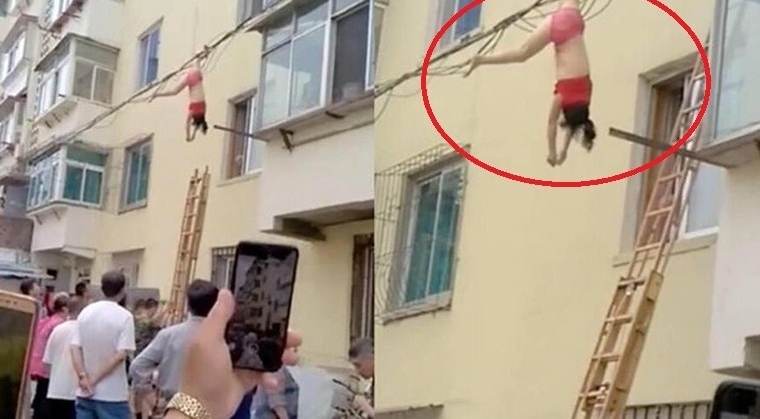 穿内衣倒挂电线杆